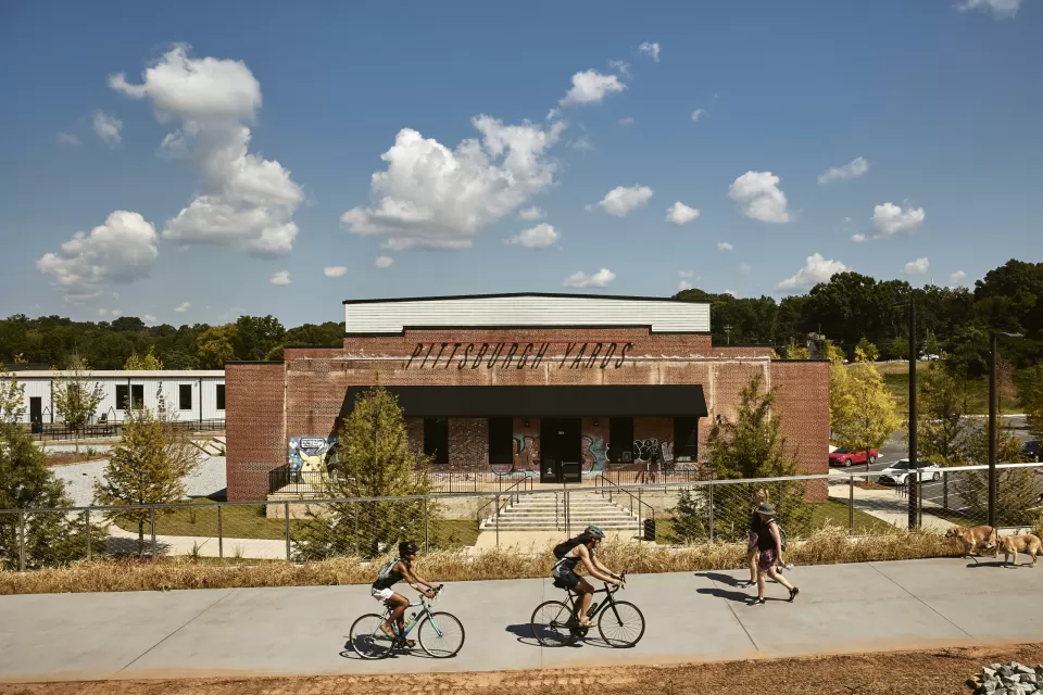People on bikes and pedestrians using the Southside Trail at Pittsburgh Yards in Atlanta.
